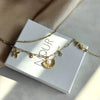 Steel Seashell Charm Bracelet